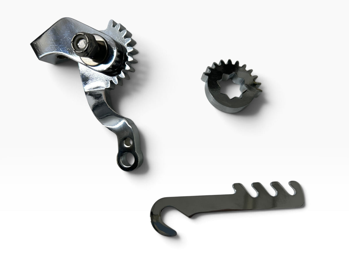Pangea Speed Brake Crossover gears, linkage arm and spring anchor on a white background