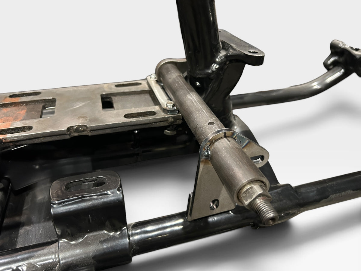 Bolt-on brake crossover assembly mounted on a hardtail frame