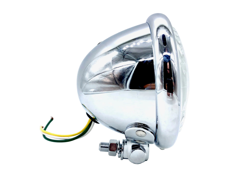 A 4.5 inch motorcycle headlight with a chrome finish and electrical wiring visible